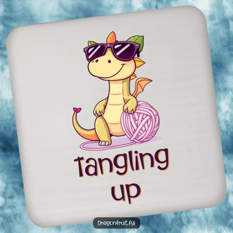 Funny drink coaster with a dragonfruit in oversized sunglasses, tripping over a giant yarn ball, adding playful humor to beverage service.