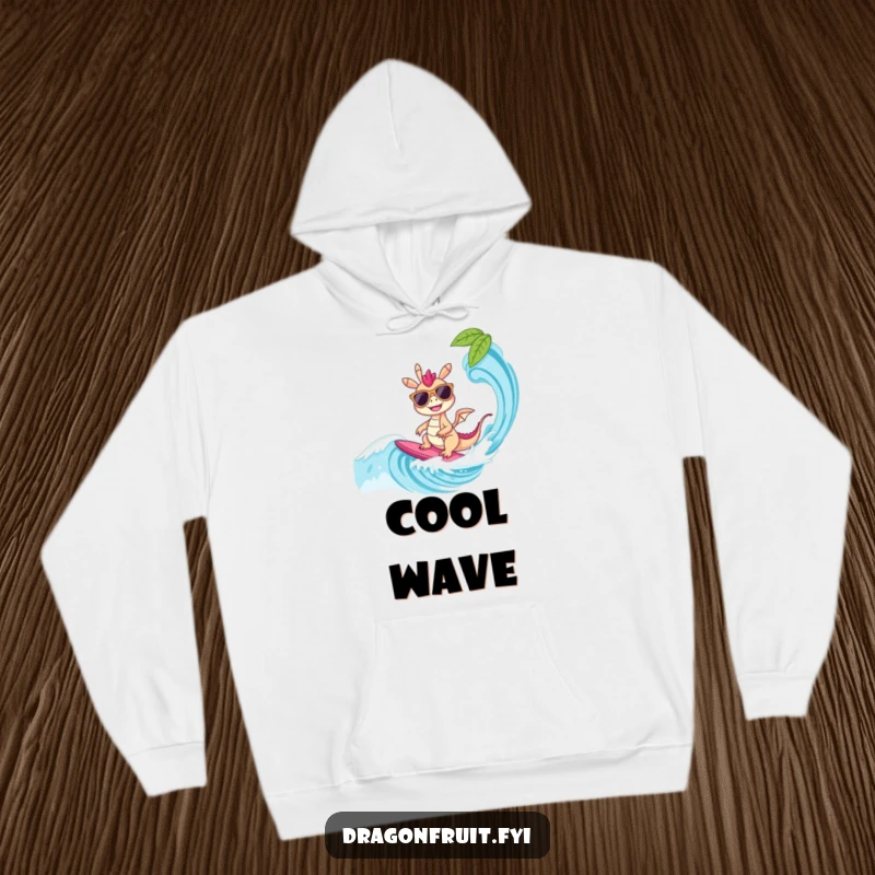 Funny Hoodie: A dragonfruit character in sunglasses surfs a wave, offering warmth and a cool, tropical-themed design for casual wear.
