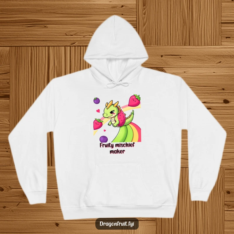 Funny mischievous dragonfruit sliding down a rainbow of fruits on a soft hoodie, bringing fruity fun.