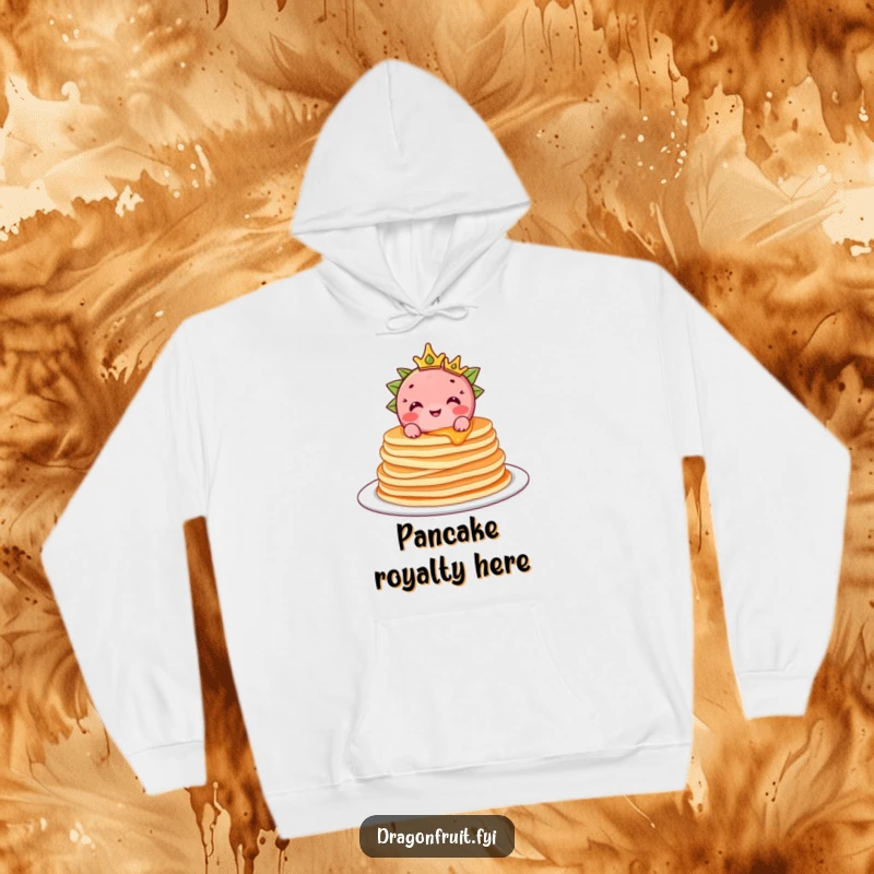 Funny Dragonfruit Hoodie: A delighted dragonfruit with a crown sits atop fluffy pancakes, offering cozy, humorous warmth.