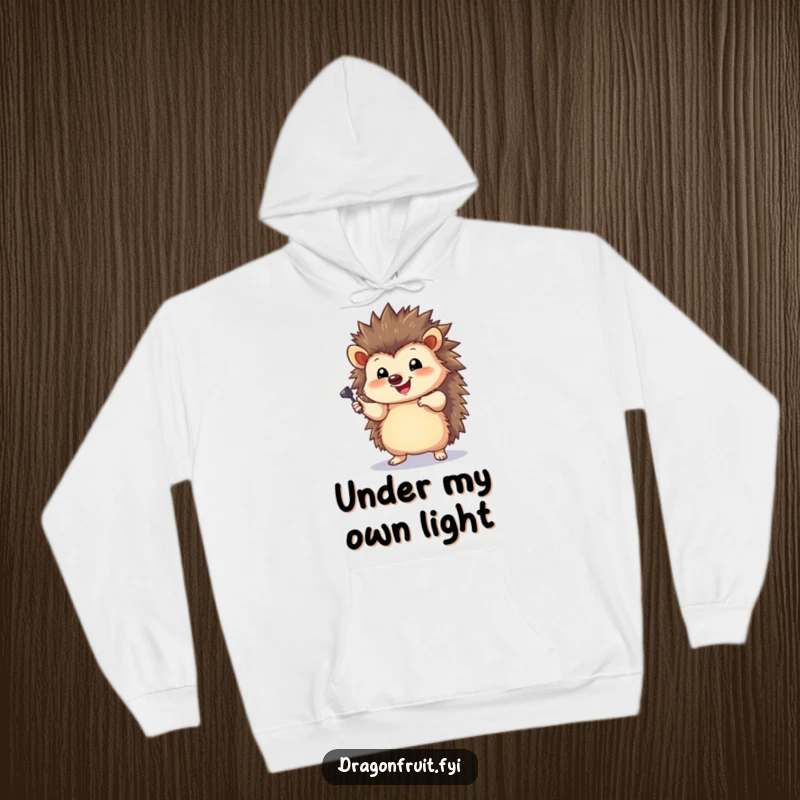 Funny Hedgehog Spotlight Hoodie featuring a happy hedgehog striking a dramatic pose under a tiny spotlight, for warmth.