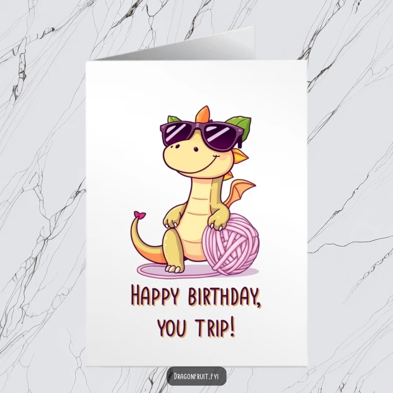 Funny Free Printable Birthday Card: A mischievous dragonfruit in sunglasses trips over a yarn ball, celebrating a wild birthday.