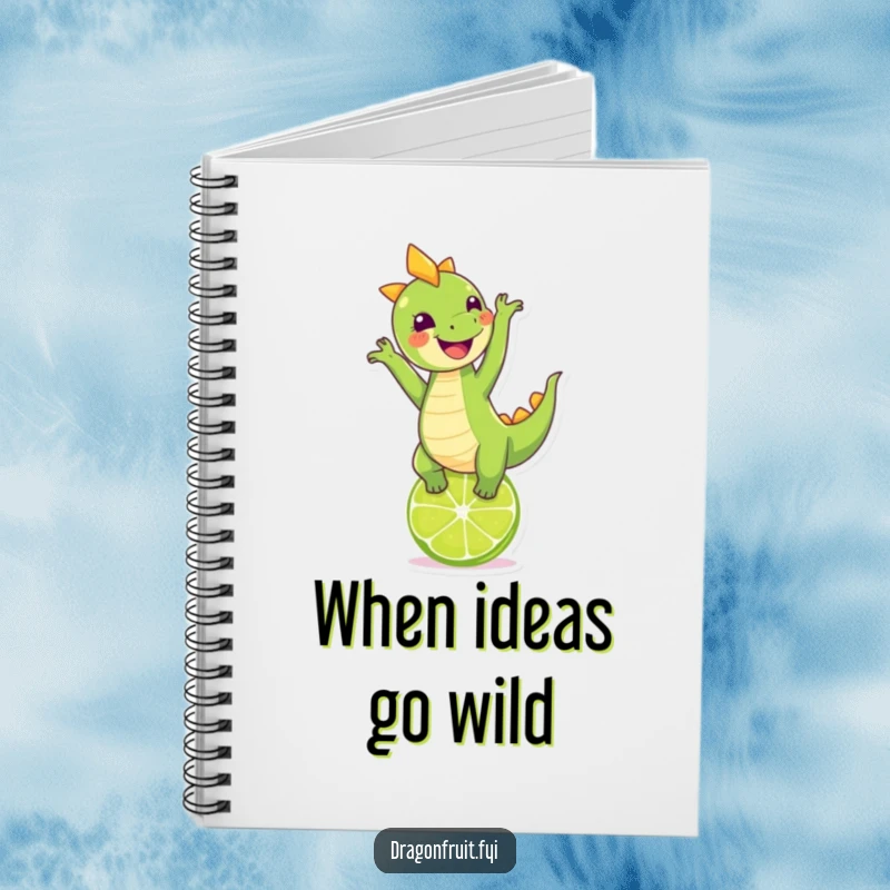 Funny dragonfruit character performing a handstand on a lime, inspiring creative writing in a notebook.