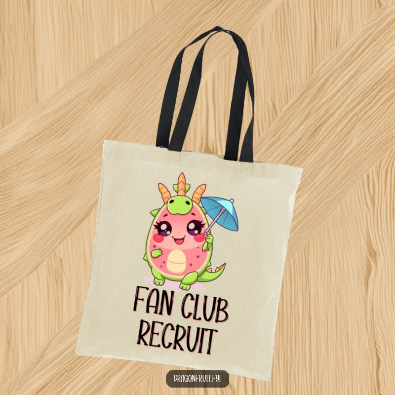 Funny tote bag showing a giggling dragonfruit wedge, large eyes, fanning with a cocktail umbrella, perfect for carrying items with flair.